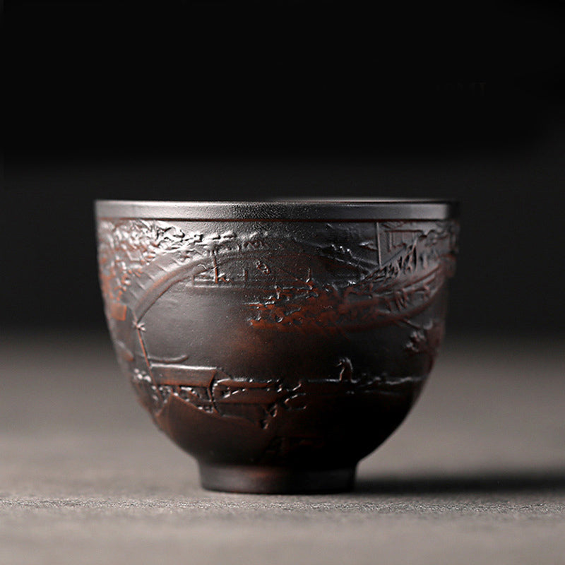 Ceramic Tea Cup – Single lotus bloom relief on matte black stoneware, minimalist tea cup