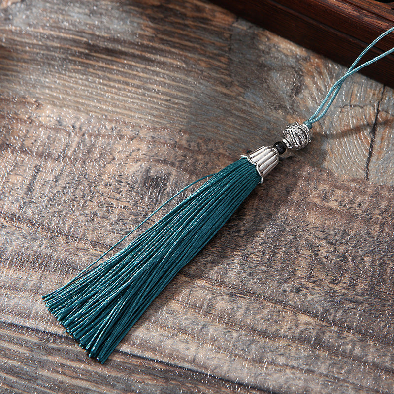 Lotus Brass Hollow Bookmark - close-up teal tassel with antique silver bead cap, boho charm