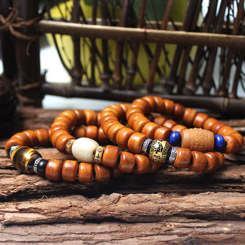 Tibetan Bone Beads Om Mani Padme Hum Bracelet – coiled wood and stone beads with tiger's eye on bamboo, mala bead bracelet