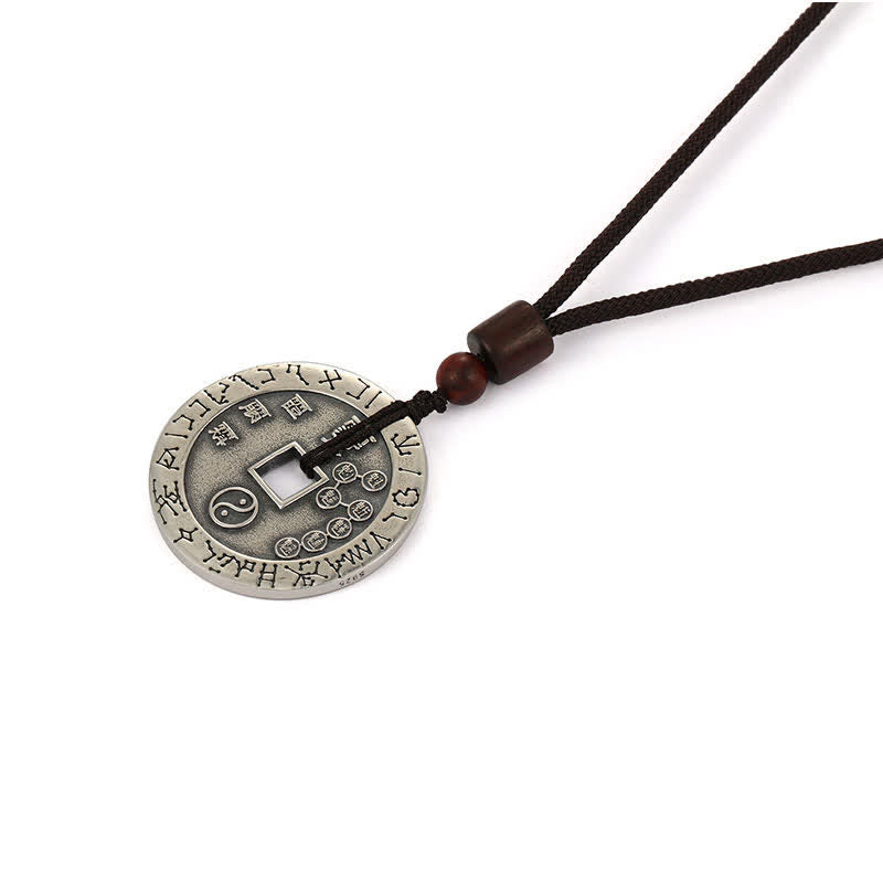 Bagua Yin Yang Obsidian Necklace - silver coin with yin-yang and star engravings, dark cord, studio