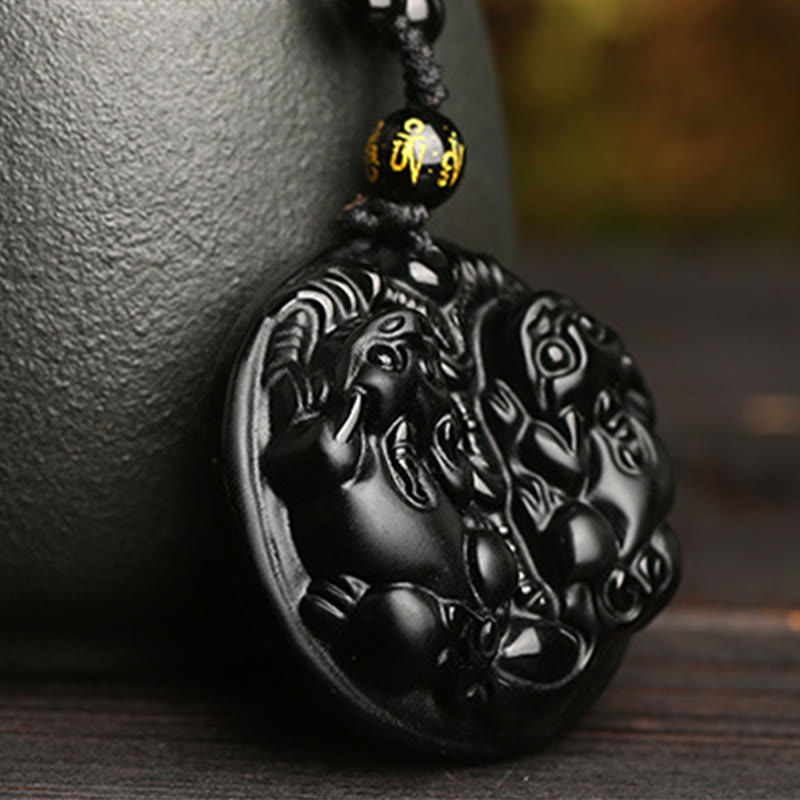 Double PiXiu Necklace – Black obsidian double PiXiu disc pendant close-up on carved wood, spiritual purification necklace