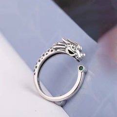 Vintage Dragon Design Ring - Detailed dragon head ring with green stone on soft blue-gray fabric, Elegance