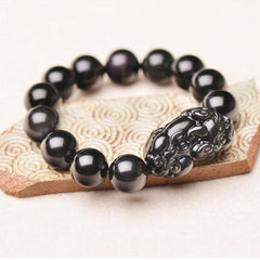 PiXiu Obsidian Bracelet – On patterned ceramic tile with black obsidian beads and carved PiXiu