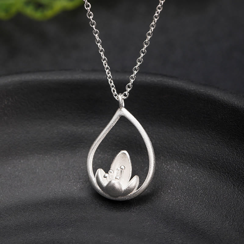 Sterling Silver Lotus Pendant – Elevated view on slate stone, polished, Elegant