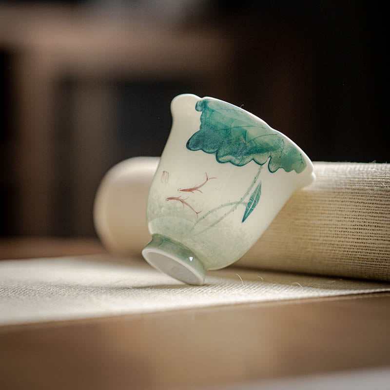 Koi Lotus Teacup – Close-up of koi fish detail in blue and white glaze