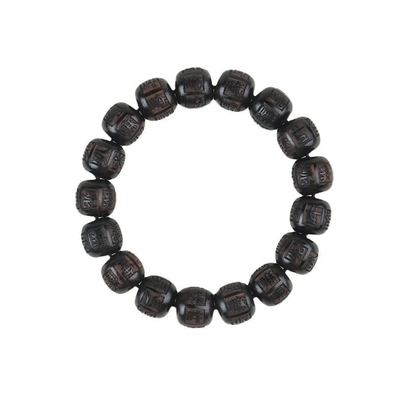Ebony Wood Mantra Bracelet – Top-down of complete mantra bead circle on clean white, carved wood