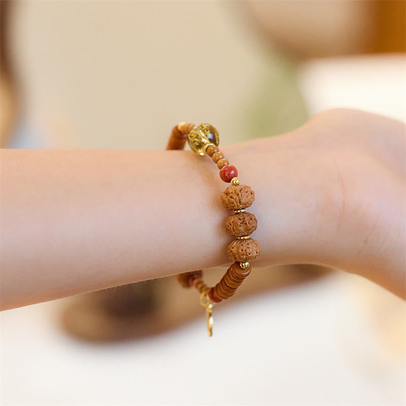 Bodhi Seed Bracelet – Rudraksha seeds with gold chain charm and red bead accent, boho wrist jewelry