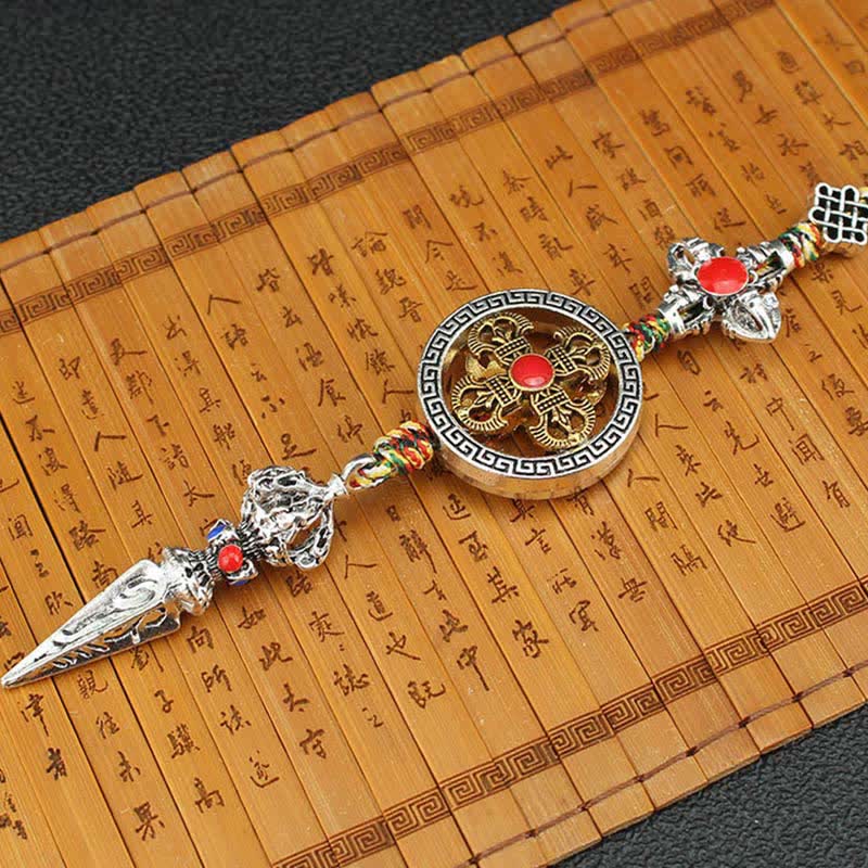 Tibetan Vajra Dorje Car Hanging – Pendant with gold vajra medallion and red stone on bamboo mat, Buddhist decor