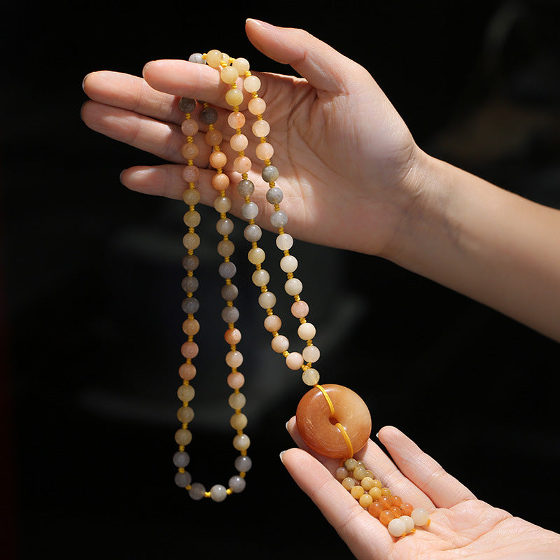 Golden Silk Jade Flower Pendant Necklace – gradient warm beads with honey-amber bi disc pendant and bead tassel, hand-held