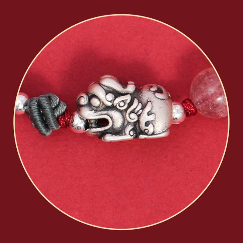 Silver PiXiu Strawberry Quartz Bracelet – Close-up silver PiXiu charm on red braided cord