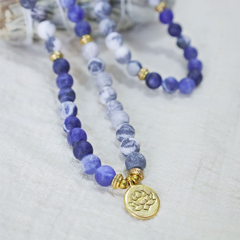 Picasso Jasper Mala – blue sodalite mala necklace with gold lotus pendant, jasper beads