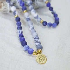 Picasso Jasper Mala – blue sodalite mala necklace with gold lotus pendant, jasper beads