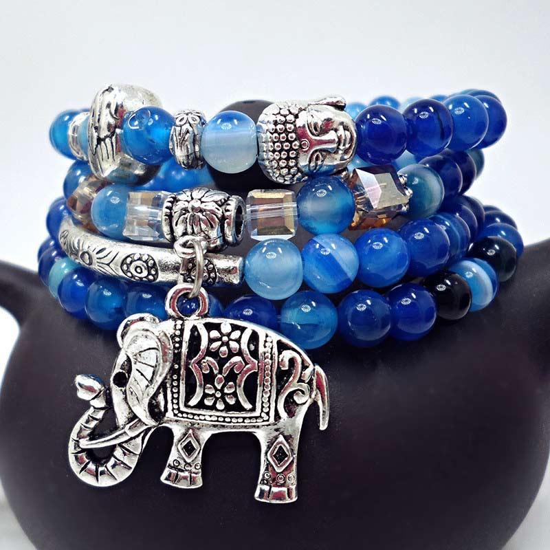 Natural Agate Elephant Buddha Bracelet – blue agate closeup with elephant charm on ceramic, macro