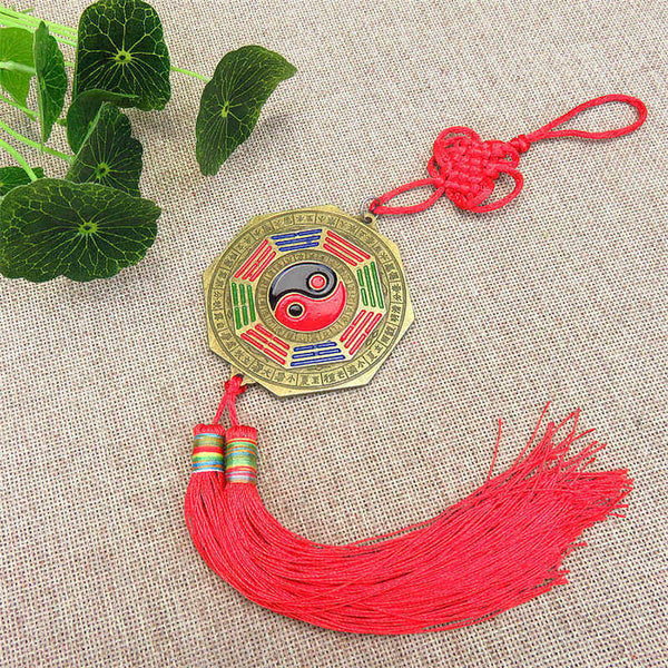 Feng Shui Bagua Map Mirror - Bagua mirror amulet with yin-yang symbol, brass frame, colored trigrams, red silk tassel on nat.