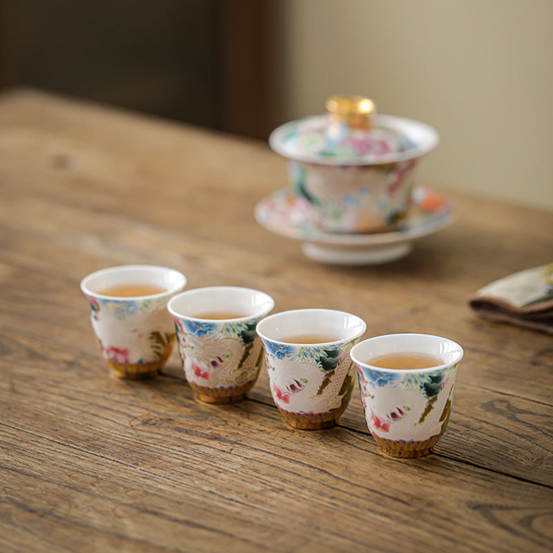 Dragon Phoenix Ceramic Teacup - Tea set with gaiwan and four cups on rustic wood table, Tea ceremony