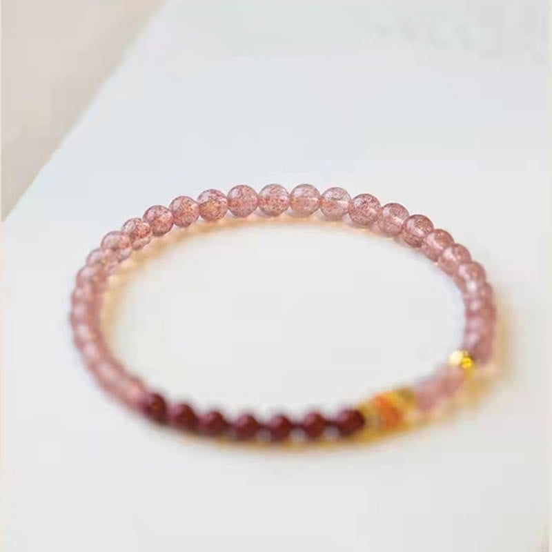 Strawberry Quartz Koi Bracelet – soft pink background complementing rosy quartz bead tones