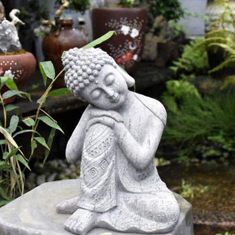 Tibetan Meditation Buddha Resin Decoration – seated resting Buddha on stone base beside ceramic pots and bamboo, resin garden ornament
