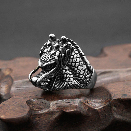 Dragon Balance Titanium Steel Ring – sculpted dragon head with flowing whiskers on wood base, strength