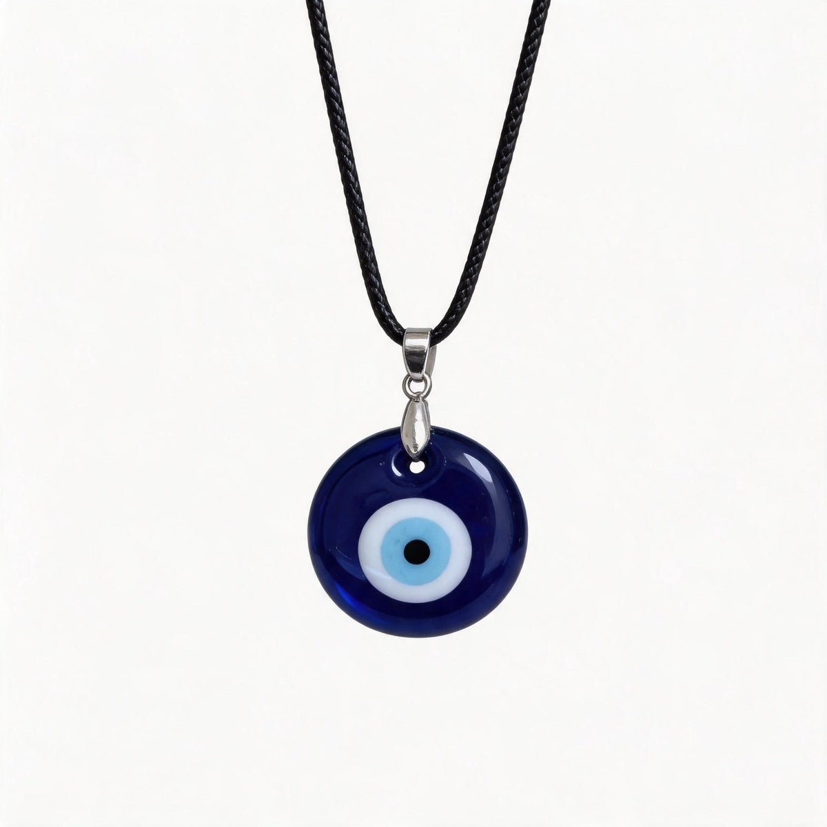 Blue Glass Evil Eye Necklace – Main studio product view of the glass eye pendant on its waxed cord