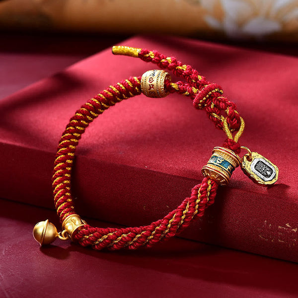 Red and gold cord bracelet with blue pendant