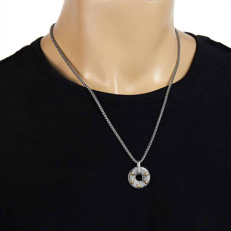 Tibetan Om Mani Padme Hum Peace Buckle Necklace – Silver chain with gold-accented circular pendant on black mannequin crew neck, white background frontal lifestyle