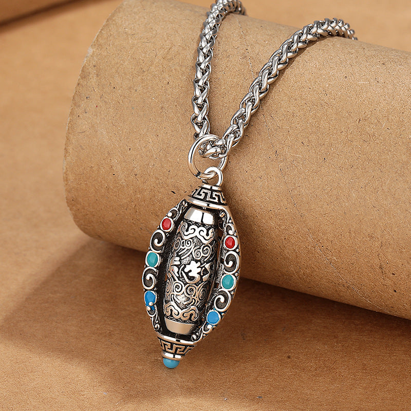 Tibetan Om Mani Padme Hum Pendant Necklace – Three-quarter view of engraved oval amulet with gemstone inlays on braided chain