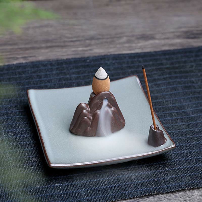 Lotus Ceramic Backflow Incense Burner - mountain sculpture with waterfall smoke pooling on green ceramic base