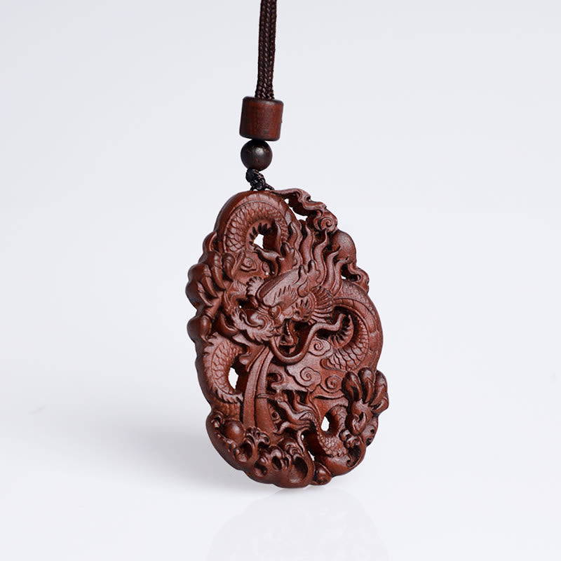 Lightning Jujube Wood Dragon Pendant - Hanging on cord with wooden beads against white, Protective