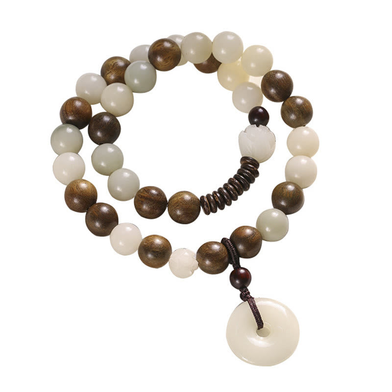 Bodhi Seed Sandalwood Lotus Bracelet - full view on white background, coiled double loop with bi disc