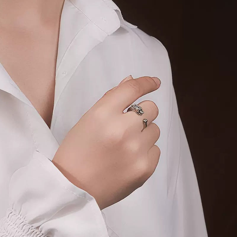 Vintage Dragon Design Ring - Silver dragon ring on hand with model in white shirt, Success