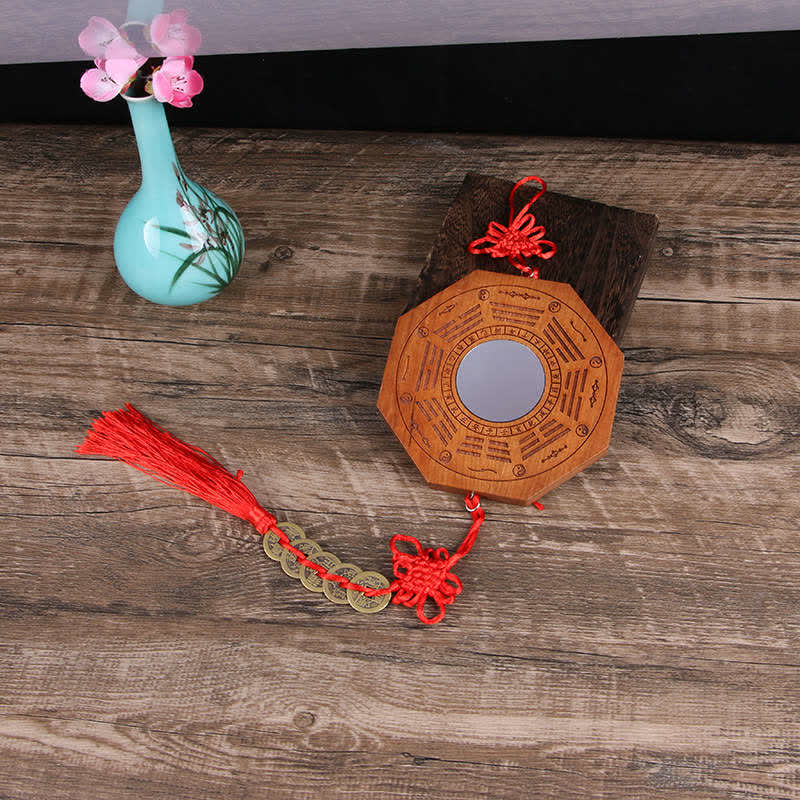 Peach Wood Bagua Map - hand-held bagua mirror showing trigram carvings and yin-yang symbols, scale ref