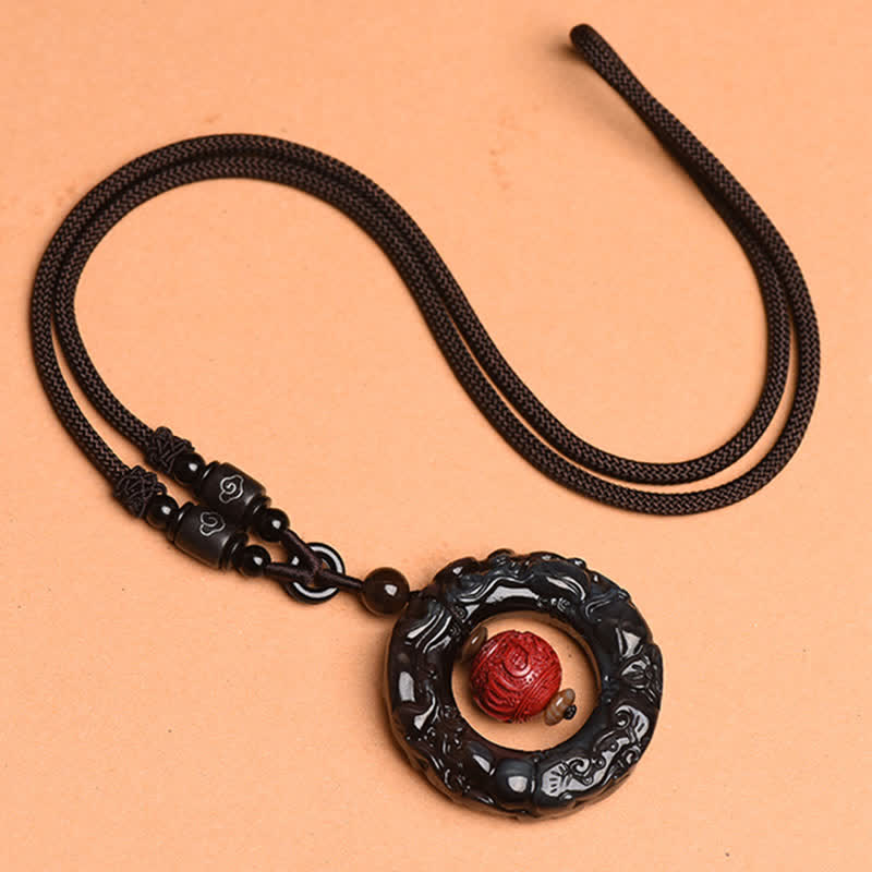 Rainbow Obsidian PiXiu Pendant – Full view of rainbow obsidian pendant on brown braided cord
