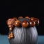 Multi-Wood Dragon Bracelet - Polished beads with carved dragon head and gourd charms on black ceramic, Strength