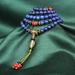 Lapis Lazuli Red Turquoise Tibetan Mala Bracelet coiled spiral on emerald green silk, 108 lapis lazuli beads with pyrite flecks, vermilion red coral markers, antique gold guru bead, mustard yellow cord tassel with red bead terminals