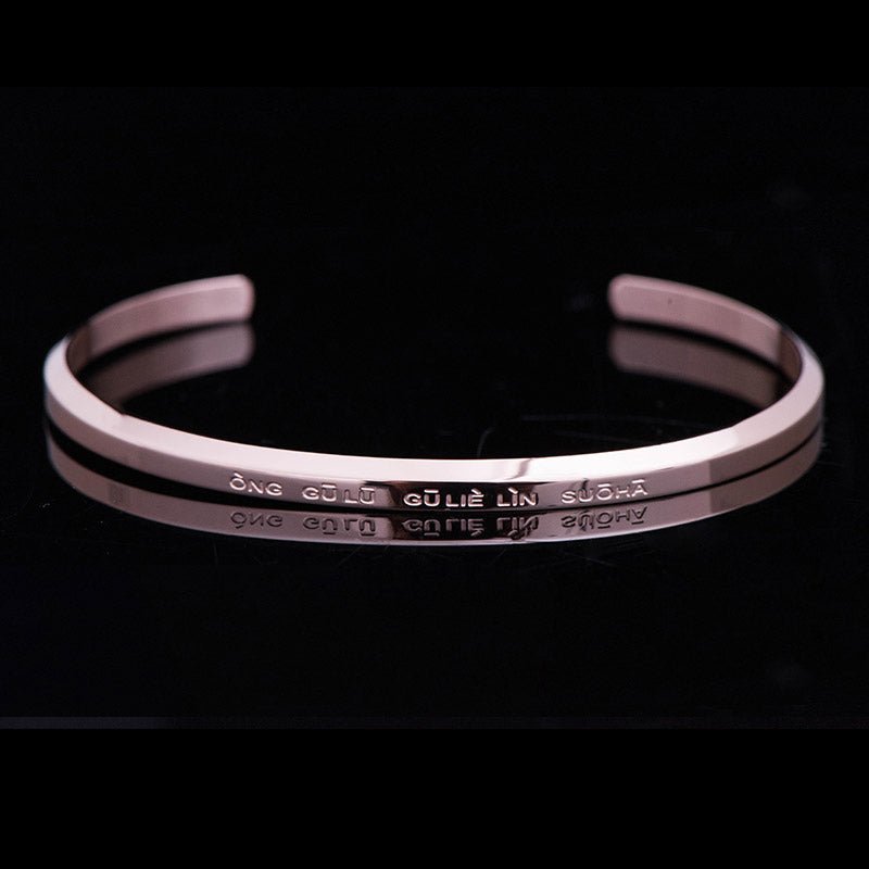 Om Mani Padme Hum Engraved Bracelet – rose gold cuff with reflective surface and mantra, metal bangle