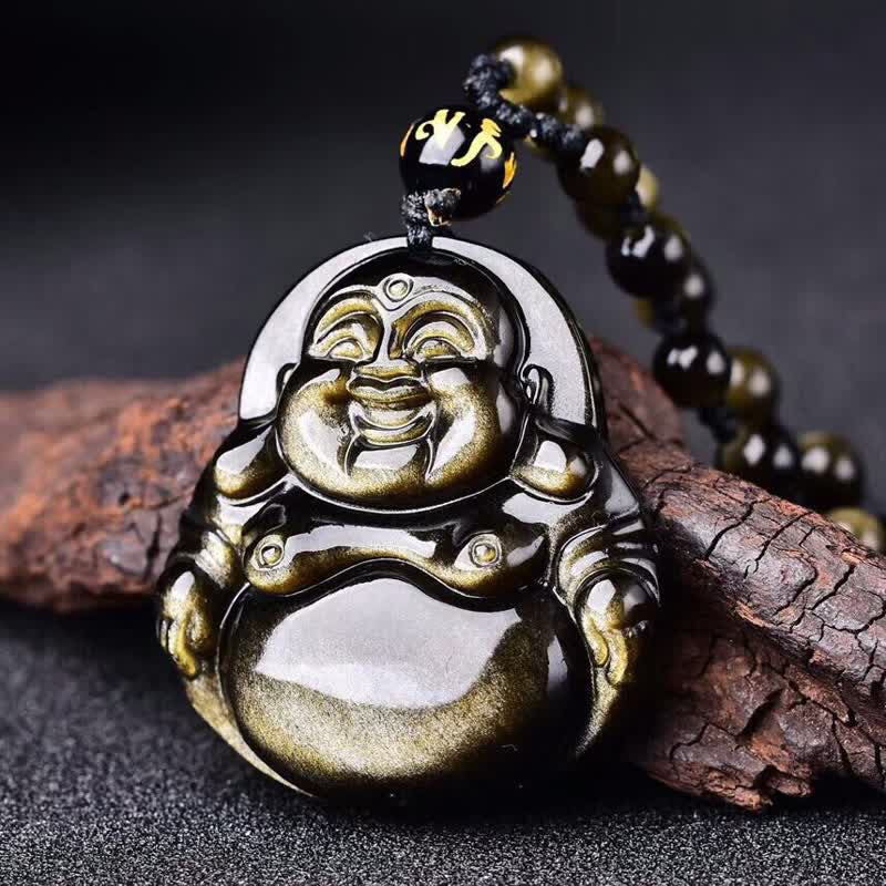 Gold Sheen Obsidian Laughing Buddha Pendant – closeup of black gold-sheen obsidian on wood, macro texture