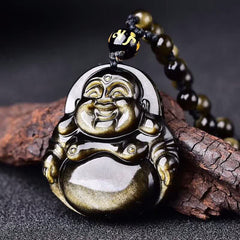 Gold Sheen Obsidian Laughing Buddha Pendant – closeup of black gold-sheen obsidian on wood, macro texture