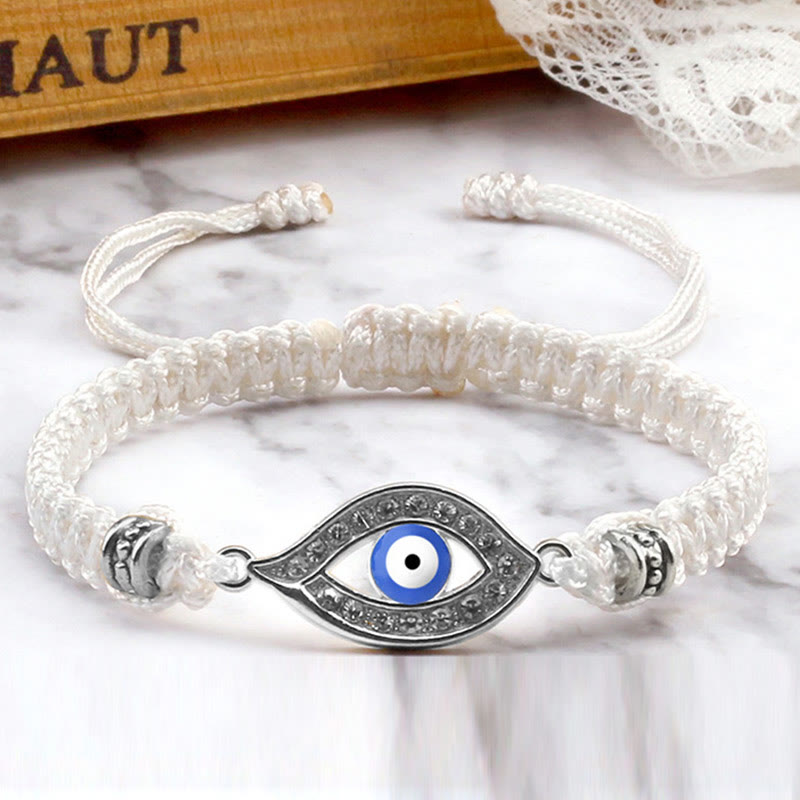 White cord evil eye bracelet with silver blue evil eye crystal charm, marble styling