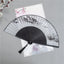 Landscape Fan White – Black fan with ink wash mountains, architecture, and lotus on white background, hand fan