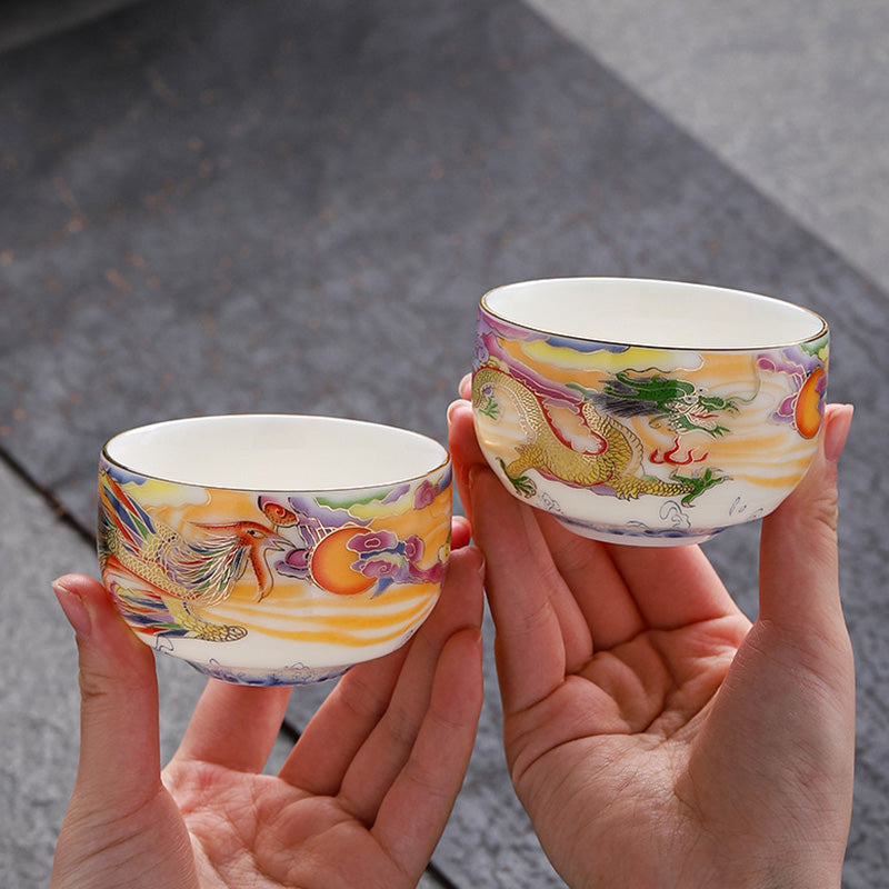 Dragon Phoenix Ceramic Teacup - Dragon and phoenix pair in open palms, blessing