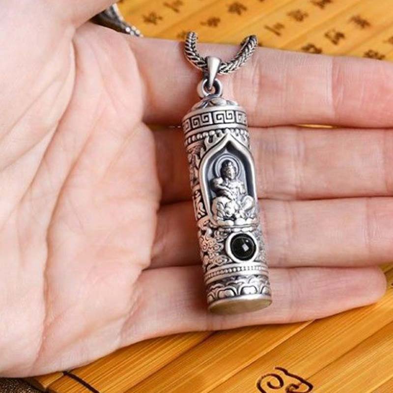 Chinese Zodiac Natal Buddha Projection Necklace – Pendant held in open palm on bamboo mat, natural scale, personal talisman