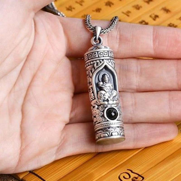 Chinese Zodiac Natal Buddha Projection Necklace – Pendant held in open palm on bamboo mat, natural scale, personal talisman