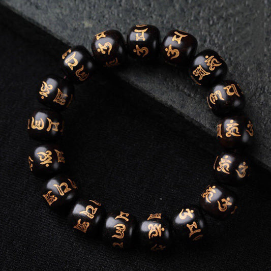 Ebony Wood Om Mani Padme Hum Bracelet – Black beads with gold mantra engravings on dark textured surface, Tibetan jewelry