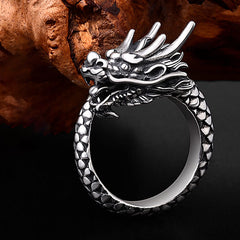 Sterling Silver Dragon Ring - angled profile on black backdrop, dragon horns and scales, masculine