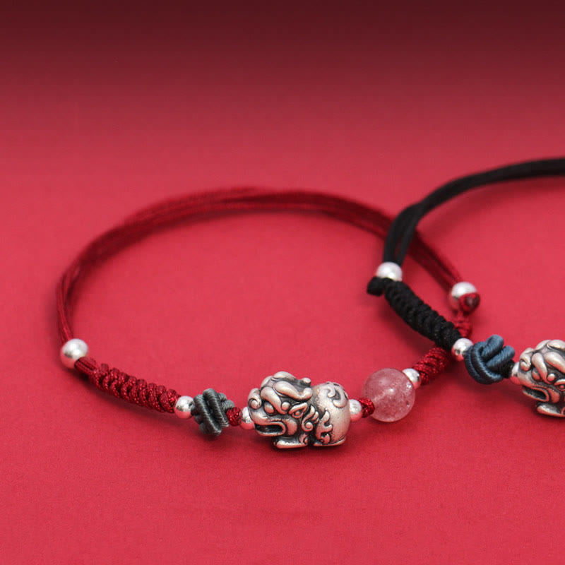 Silver PiXiu Strawberry Quartz Bracelet – Red black overlapping bracelets close-up on red