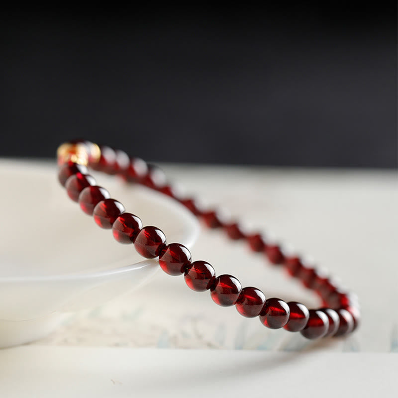 999 Gold Koi Bracelet – clasp and toggle detail, natural garnet beads, gold koi protection bracelet