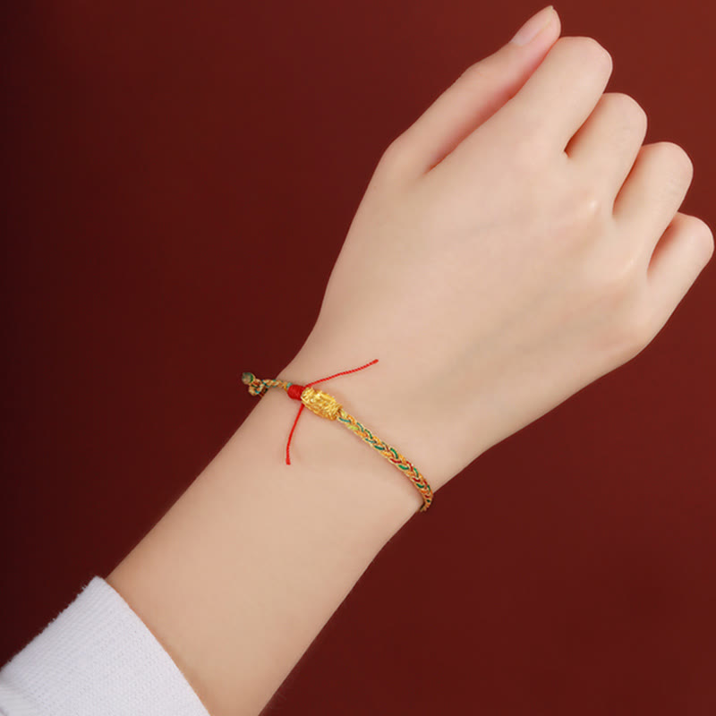 Year of the Dragon Braided Bracelet - Wrist side view with braided band and charm, Wearable culture