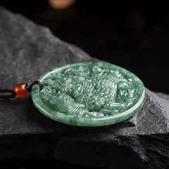 Jade Kirin Necklace – Forest green qilin carved jade medallion on slate with warm bokeh, abundance pendant