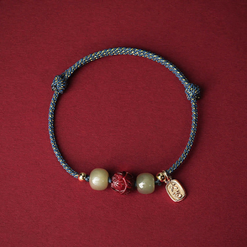 Hetian Jade Cinnabar Lotus Bracelet – Blue and gold cord with wealth charm and lotus bead, blue cord bracelet