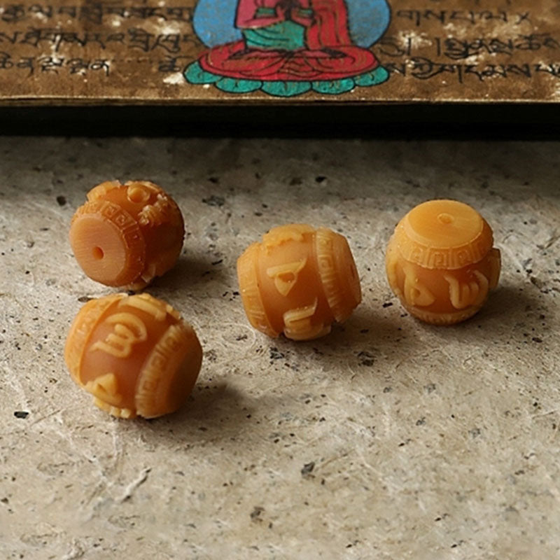 108 Bodhi Seed Mala Bracelet – Carved mantra beads in amber with Tibetan script, prayer bead detail